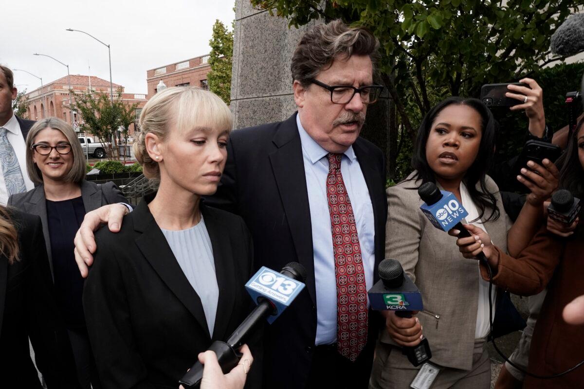 Sherri Papini arrives at the federal courthouse for sentencing accompanied by her attorney, William Portanova (R), in Sacramento, Calif., on Sept. 19, 2022. (Rich Pedroncelli/AP Photo)