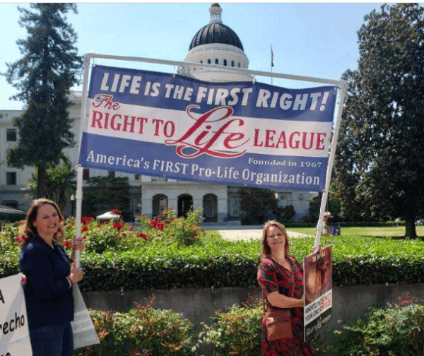 Right to Life League President Theresa Brennan (L) and Vice President Susan Arnall march with the Right to Life League banner during the California March for Life event in August 2021. (Courtesy of Susan Arnall)