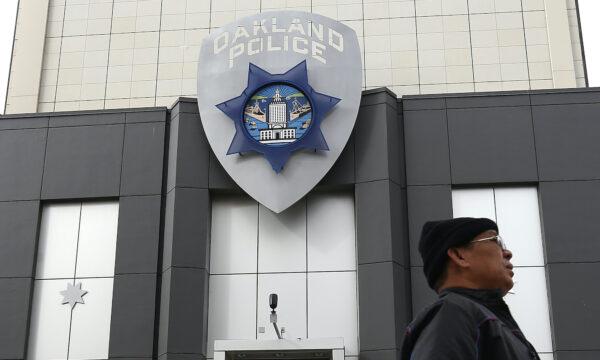 A man walks by the Oakland Police headquarters in Oakland, Calif., on Dec. 6, 2012. (Justin Sullivan/Getty Images)