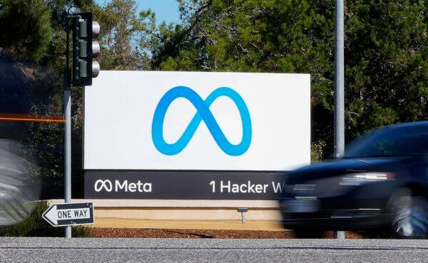 A car passes Facebook's new Meta logo on a sign at the company headquarters in Menlo Park, Calif., on Oct. 28, 2021. (Tony Avelar/AP Photo)