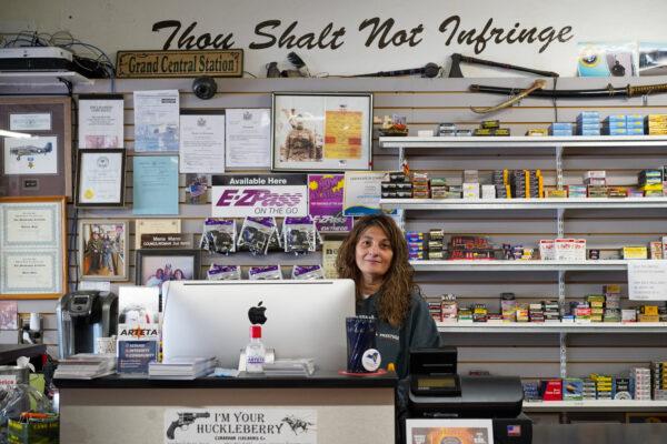 Maria Mann at the Gun Lady store in downtown Port Jervis, N.Y., on Oct. 10, 2022. (Cara Ding/The Epoch Times)
