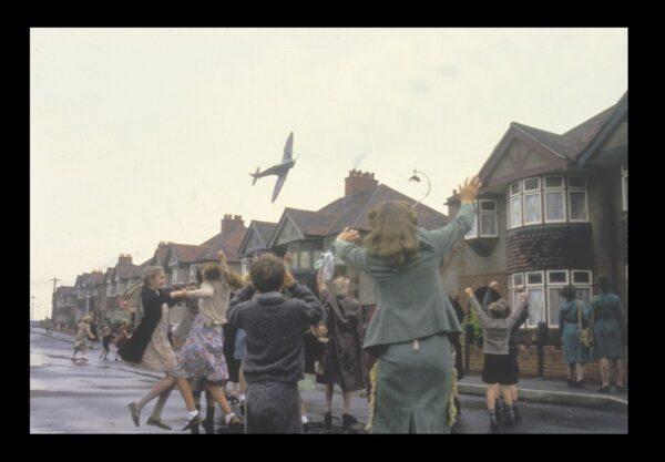 Among other flying objects, a plane catches the attention of children in London during the Blitz in World War II in "Hope and Glory." (Columbia Pictures)