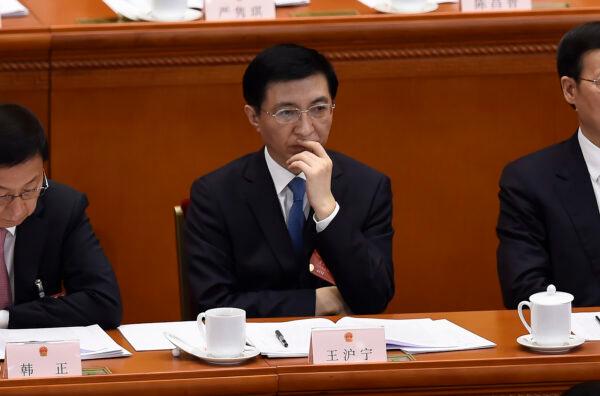 Wang Huning (C), a member of the Standing Committee of the Political Bureau of the CCP’s Central Committee, attends the opening session of the National People's Congress in Beijing on March 5, 2018. (Wang Zhao/AFP via Getty Images)