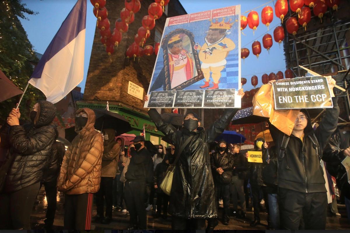 Protesters march through Chinatown in support of Bob Chan on Oct. 23, 2022, in London, United Kingdom. Bob Chan was dragged into the grounds of the Manchester Consulate and beaten up during a Hong Kong pro-democracy protest on Oct. 16, 2022. (Martin Pope/Getty Images)