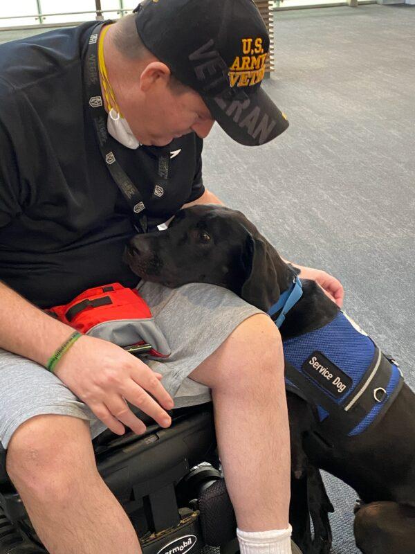 Duff, a rescue-turned-service dog, is placed with his working partner. (Courtesy of Cell Dogs, Inc.)