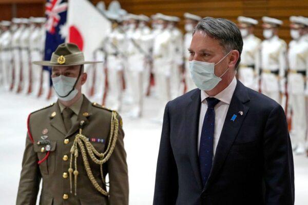 Australian Deputy Prime Minister and Defense Minister Richard Marles (R) inspects an honor guard ceremony prior to a Japan-Australia bilateral defense meeting at the Japanese Ministry of Defense in Tokyo, Japan on June 15, 2022. (Shuji Kajiyama / POOL / AFP via Getty Images)