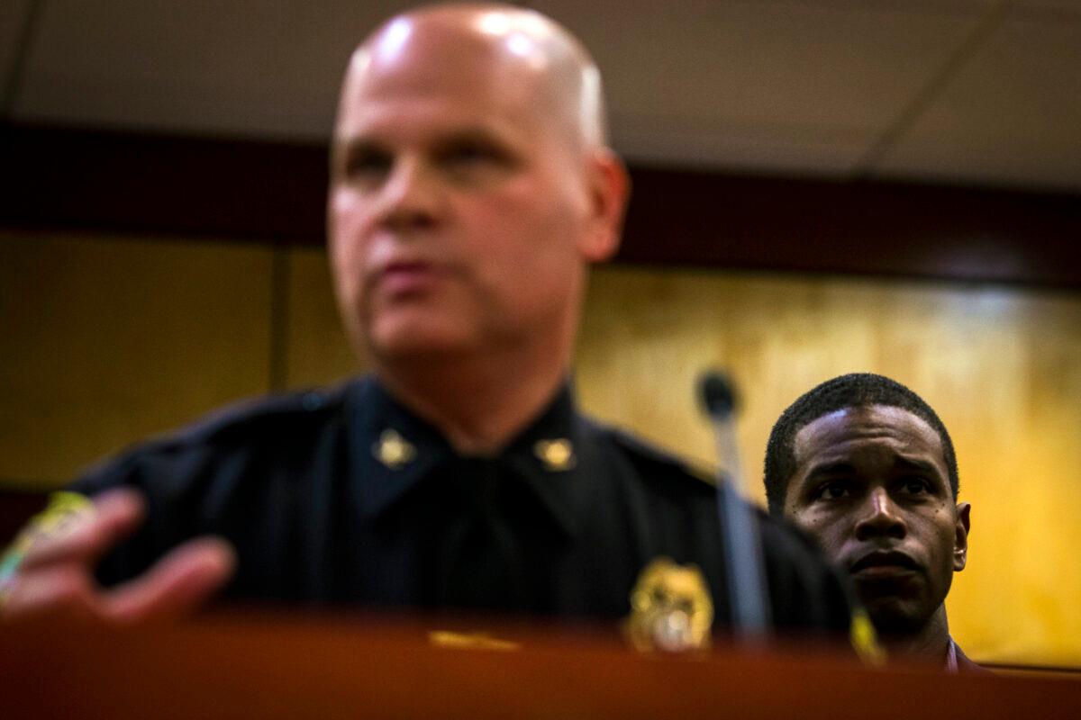 Newport News Mayor Phillip Jones listens to Police Chief Steve Drew as he gives an update on a school shooting during a press conference in the Newport News School Administration Building in Newport News, Va., on Jan. 9, 2023. (John C. Clark/AP Photo)