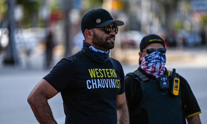 Chairman of the Proud Boys, Enrique Tarrio (L), looks on while counter-protesting near the Torch of Friendship, where people gathered to remember George Floyd on the first anniversary of his death on May 25, 2021. (Chandan Khanna/AFP via Getty Images)