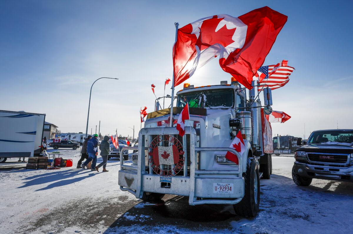 The last truck blocking the southbound lane moves after a breakthrough to resolve the impasse at a protest blockade at the Canada-U.S. border in Coutts, Alta., on Feb. 2, 2022. (Jeff McIntosh/The Canadian Press)