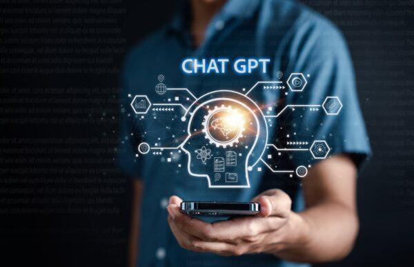Businessman using a chatbot in smartphone intelligence AI. Chat GPT with AI Artificial Intelligence, developed by OpenAI generate. Futuristic technology, a robot in an online system. (Shutterstock)