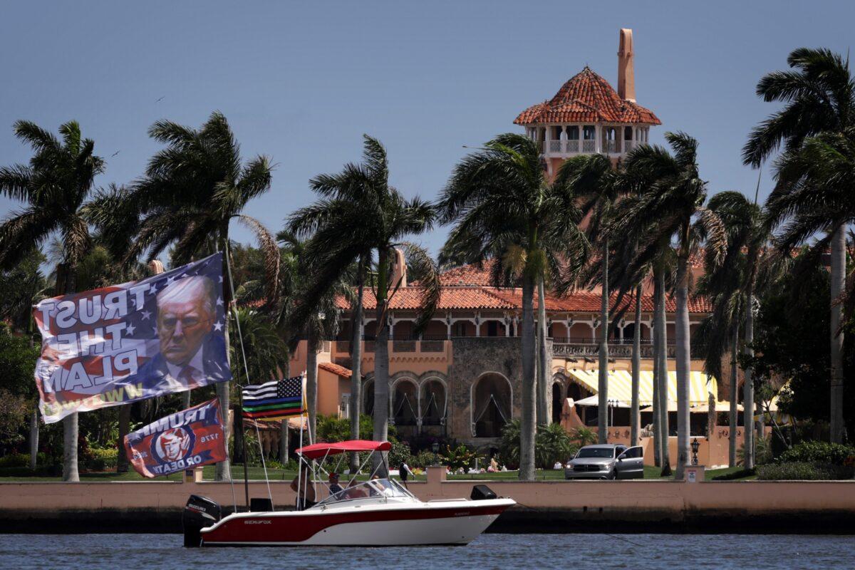 Supporters fly flags on a boat to show support near former President Donald Trump's Mar-a-Lago home in Palm Beach, Fla., on April 1, 2023. (Alex Wong/Getty Images)