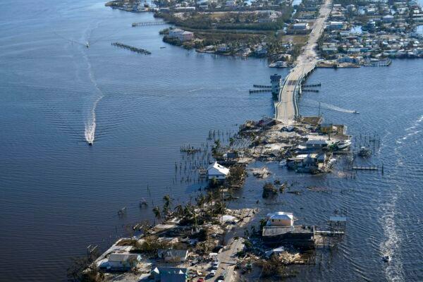 The bridge leading from Fort Myers to Pine Island, Fla., on Oct. 1, 2022, is heavily damaged in the aftermath of Hurricane Ian. (Gerald Herbert/AP Photo)