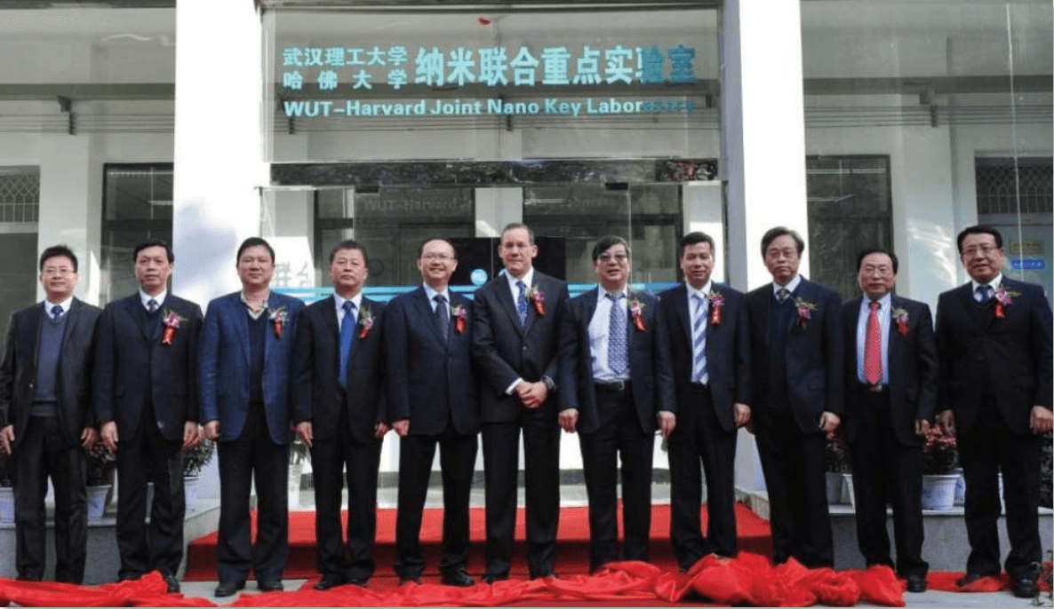 Charles Lieber (C) takes part in a group photo in front of the WUT-Harvard Joint Nano Key Laboratory, in Wuhan, China, in 2012. (Department of Justice)