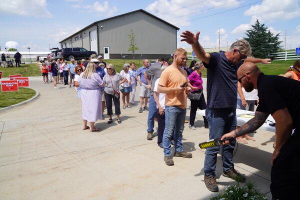 Iowans line up in nearly 90-degree heat to hear Florida Gov. Ron DeSantis deliver a 2024 GOP presidential primary speech in Pella, about 45 miles southeast of Des Moines, Iowa, on May 31, 2023. (John Haughey/The Epoch Times)