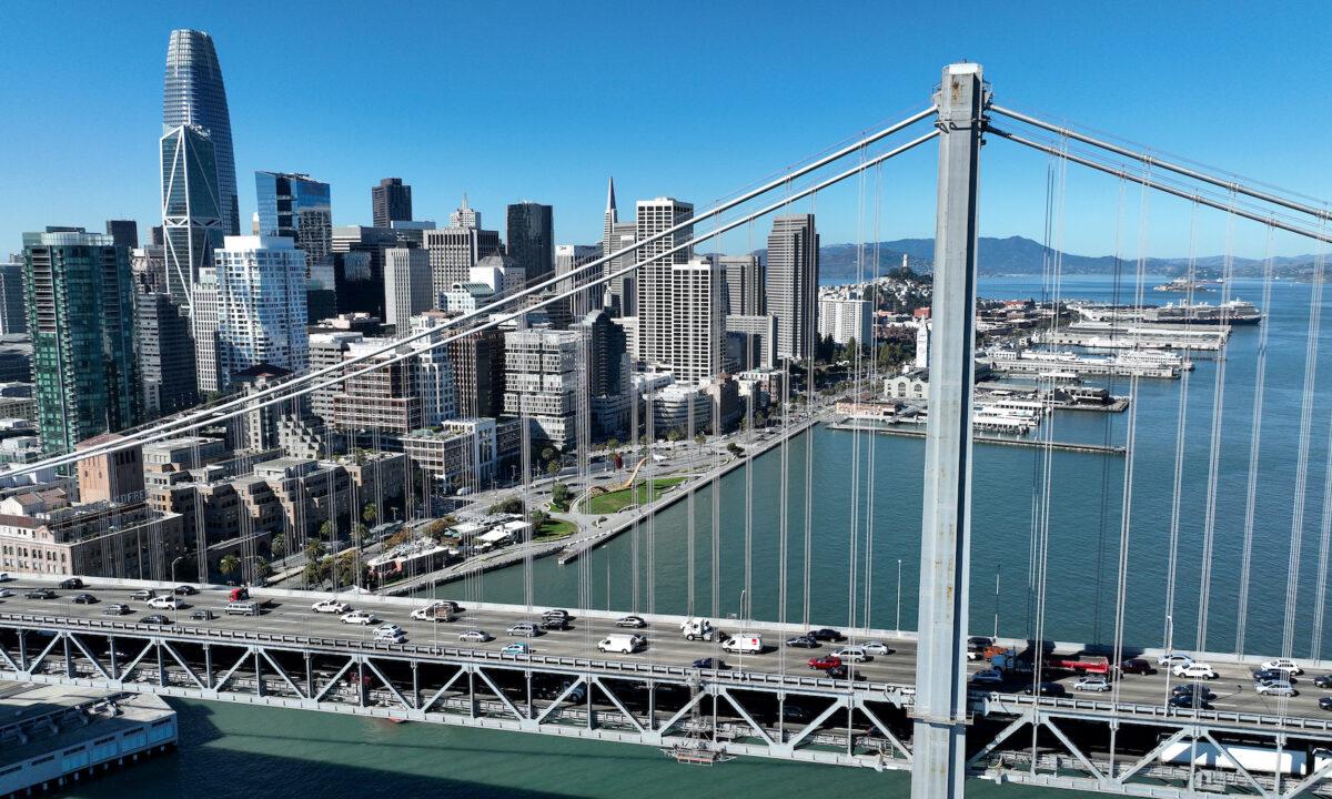 In an aerial view, cars drive by the San Francisco skyline as they cross the San Francisco-Oakland Bay Bridge in San Francisco, Calif., on Oct. 27, 2022. (Justin Sullivan/Getty Images)