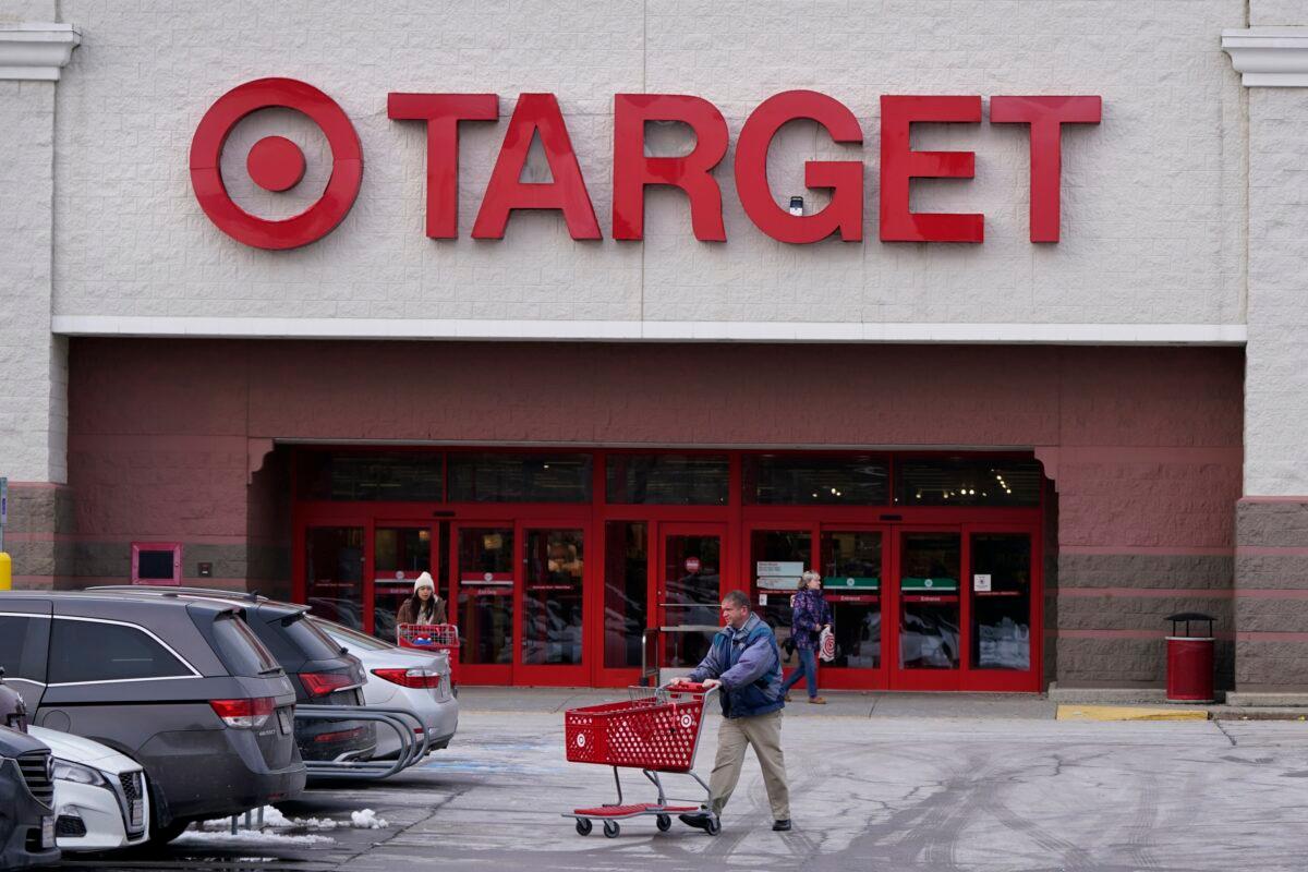 A shopper wheels a cart through the parking lot after making a purchase at the Target store in Salem, N.H., on Feb. 27, 2023. (Charles Krupa/AP Photo)