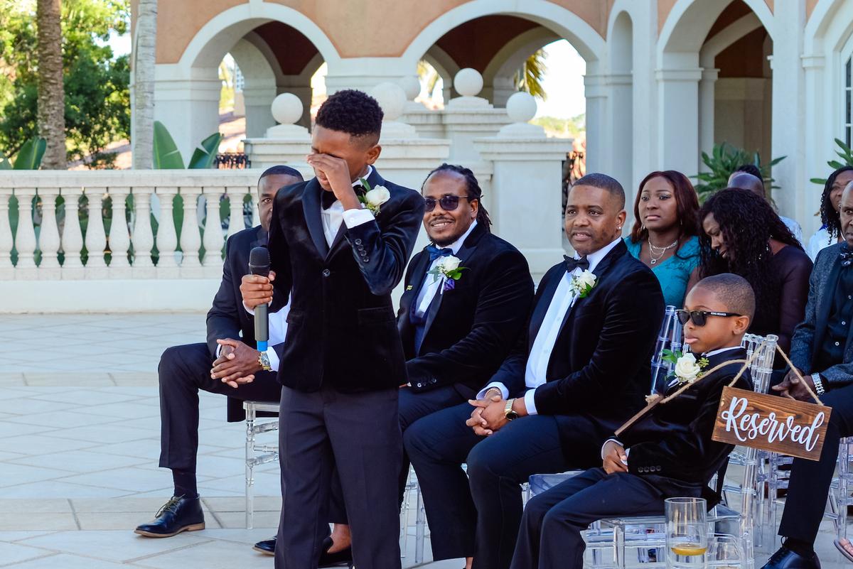 Aiden is overcome with emotion as he begins singing at his parents' vow renewal ceremony. (Courtesy of Eva Campbell @ Eva-photography via Kemorene Mills-Armstrong)