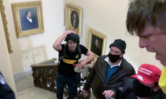 Christopher Grider (right) shouts at police after the shooting of Ashli Babbitt outside the Speaker's Lobby at the U.S. Capitol on Jan. 6, 2021. (Sam Montoya/For The Epoch Times)