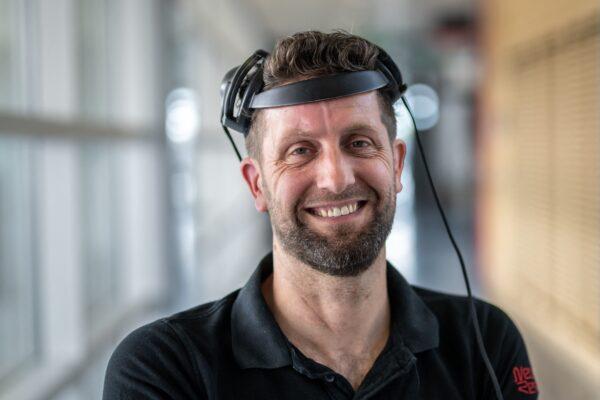 Musk's Neuralink to Start Human Trials of Brain Implant for Paralysis Patients | USNN World News Gert-Jan Oskam, 40, victim of a spinal cord injury that left him paralyzed, poses with his implants that allows him to walk naturally during a press conference in Lausanne, Switzerland, on May 23, 2023. (Fabrice Coffrini/AFP via Getty Images)
