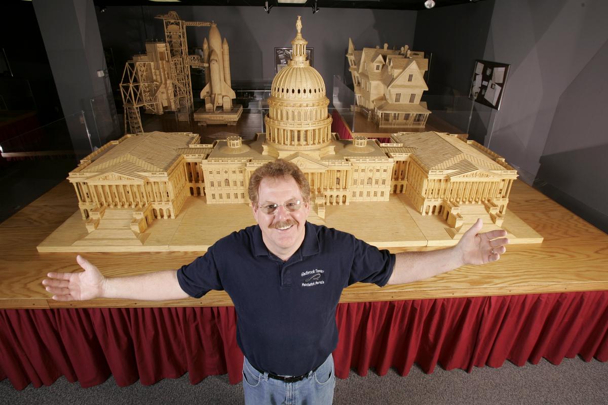 Acton poses in front of a model of the U.S. Capitol, made of 478,000 matchsticks, completed in 2001. (Courtesy of Patrick Acton)
