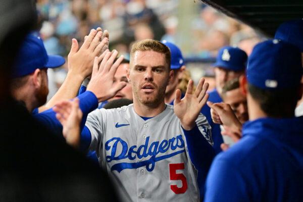 Freddie Freeman (5) of the Los Angeles Dodgers celebrates with teammates after scoring in the third inning against the Tampa Bay Rays at Tropicana Field in St. Petersburg, Fla., on May 26, 2023. (Julio Aguilar/Getty Images)