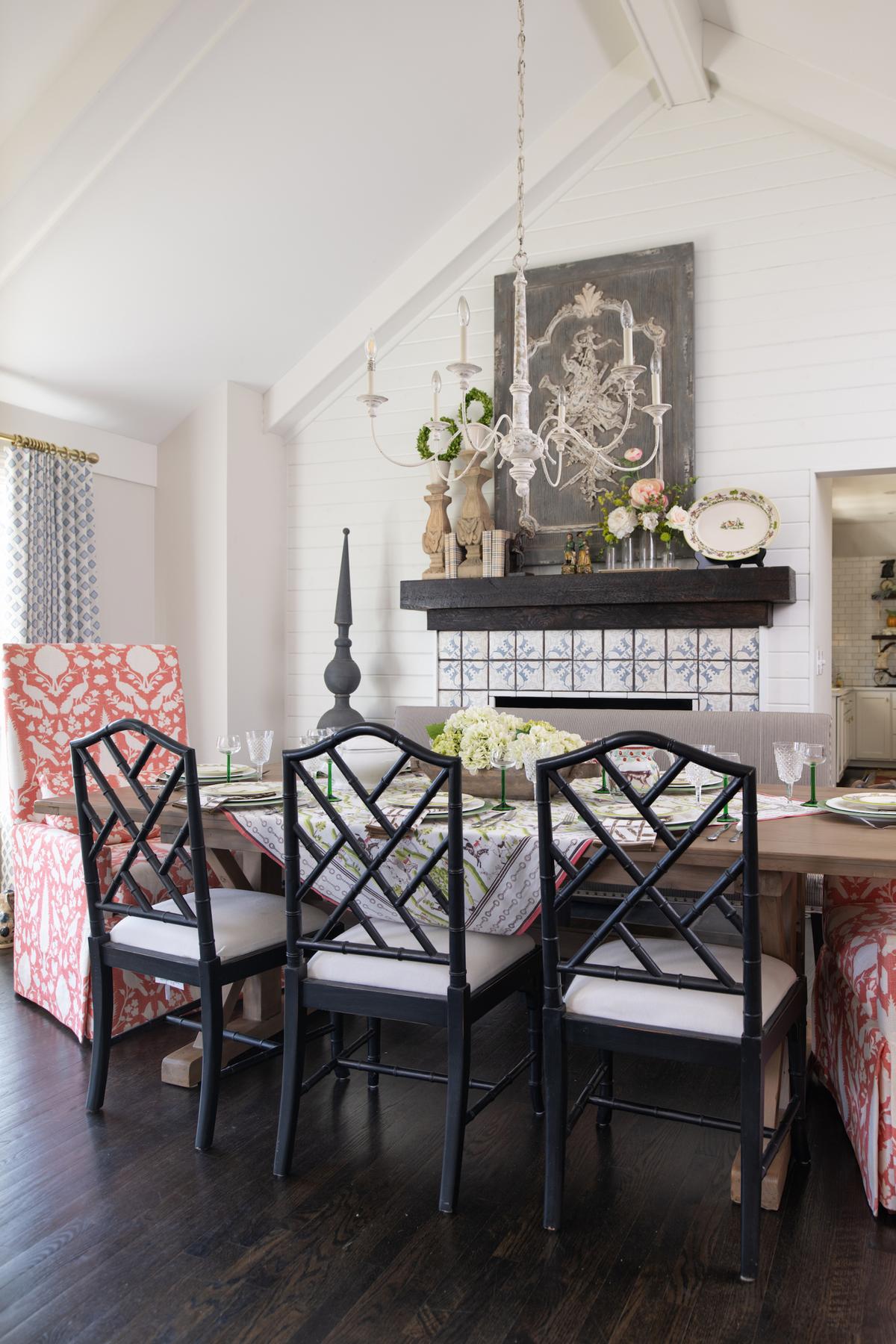 In the dining room, bamboo Chippendale chairs are pulled up to an expansive table, twin upholstered chairs in a coral colorway flank either side in a popular otomi pattern. (Handout/TNS)