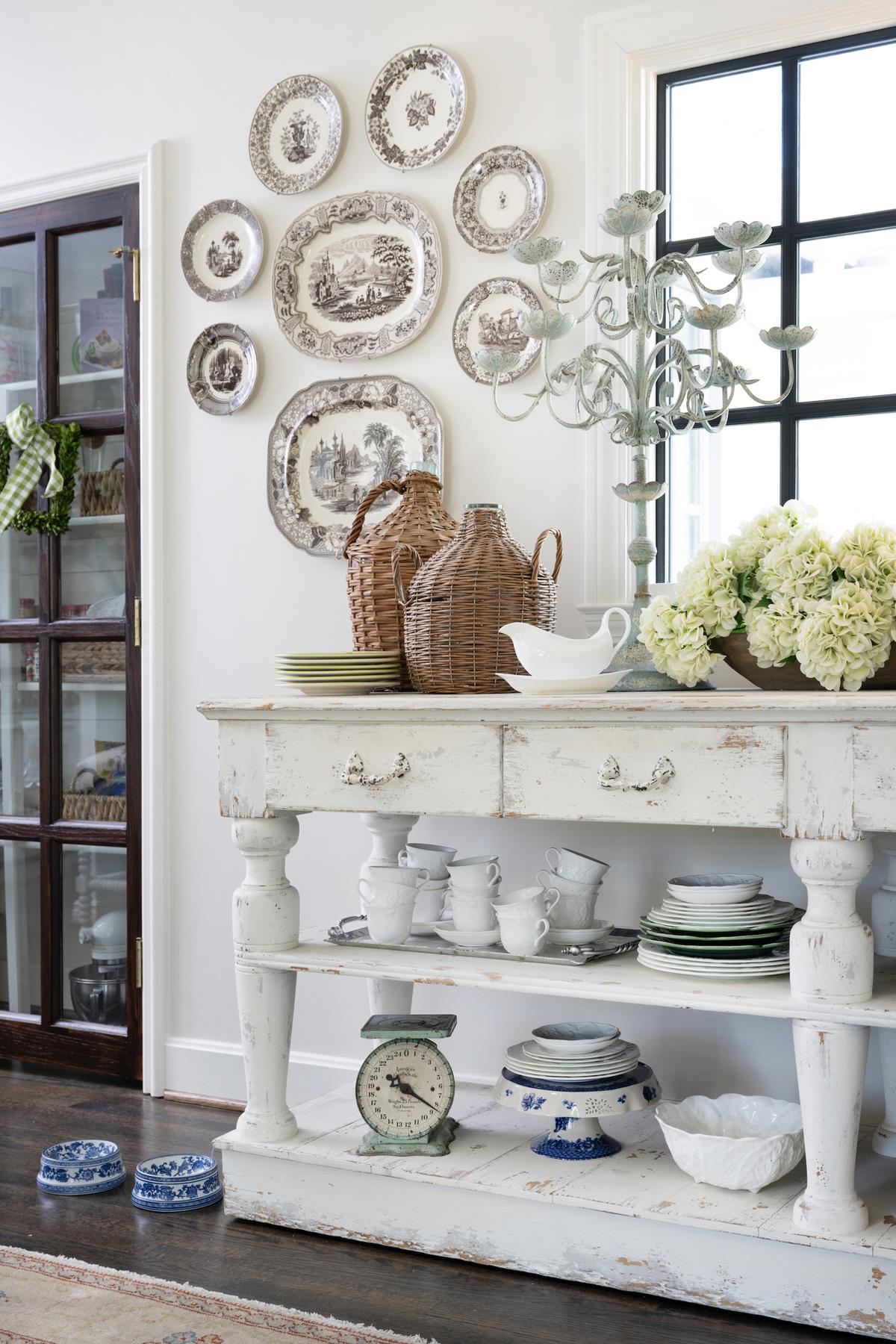 To the right of the pantry is a rustic vintage-inspired buffet layered with everyday pieces and stacks of dainty dishes. (Handout/TNS)