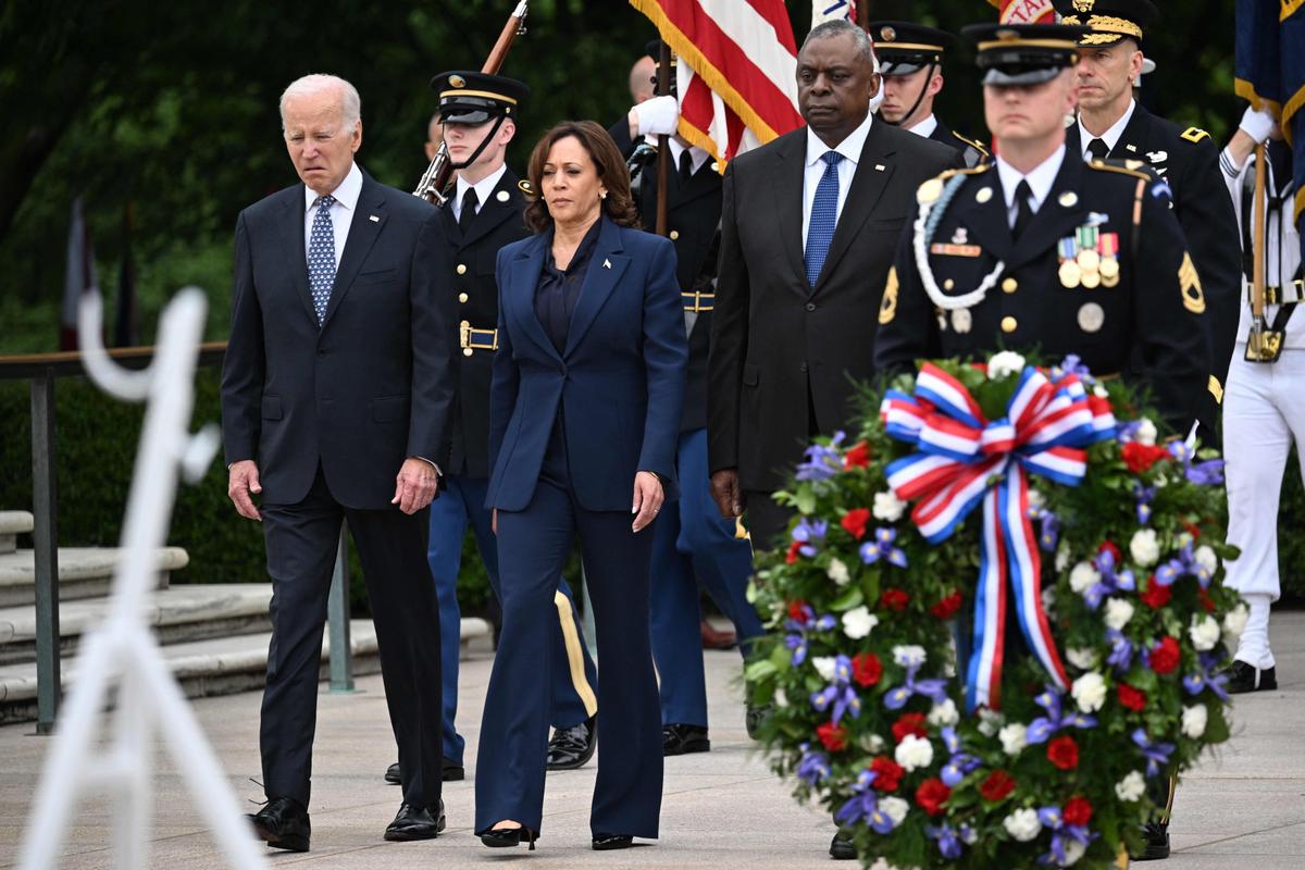 President Joe Biden, Vice President Kamala Harris, and Defense Secretary Lloyd Austin arrive to participate in a wreath-laying ceremony at the Tomb of the Unknown Soldier in Arlington National Cemetery in Arlington, Va., on May 29, 2023, in observance of Memorial Day. (Mandel Ngan/AFP via Getty Images)