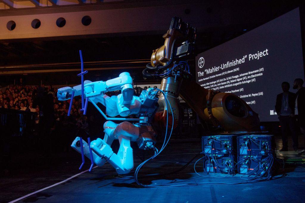 A robot stands on stage during the "Mahler Unfinished Project" at the Ars Electronica in Linz, Upper Austria, on Sept. 6, 2019. A performance of Gustav Mahler's unfinished Symphony No.10 was played, followed by six minutes of "Mahleresque" music written by software. (Alex Halada/AFP via Getty Images)