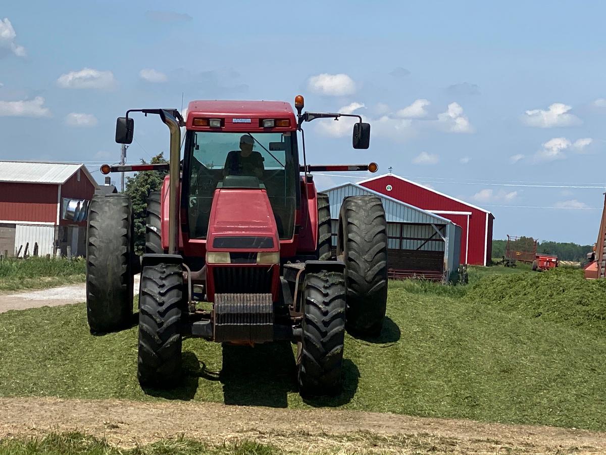 Caleb at 9 years old driving the massive CASE IH 8940 tractor to help pack the corn silage pile at the Bergner Beef Family Farm. (Courtesy of Jill Bergner)