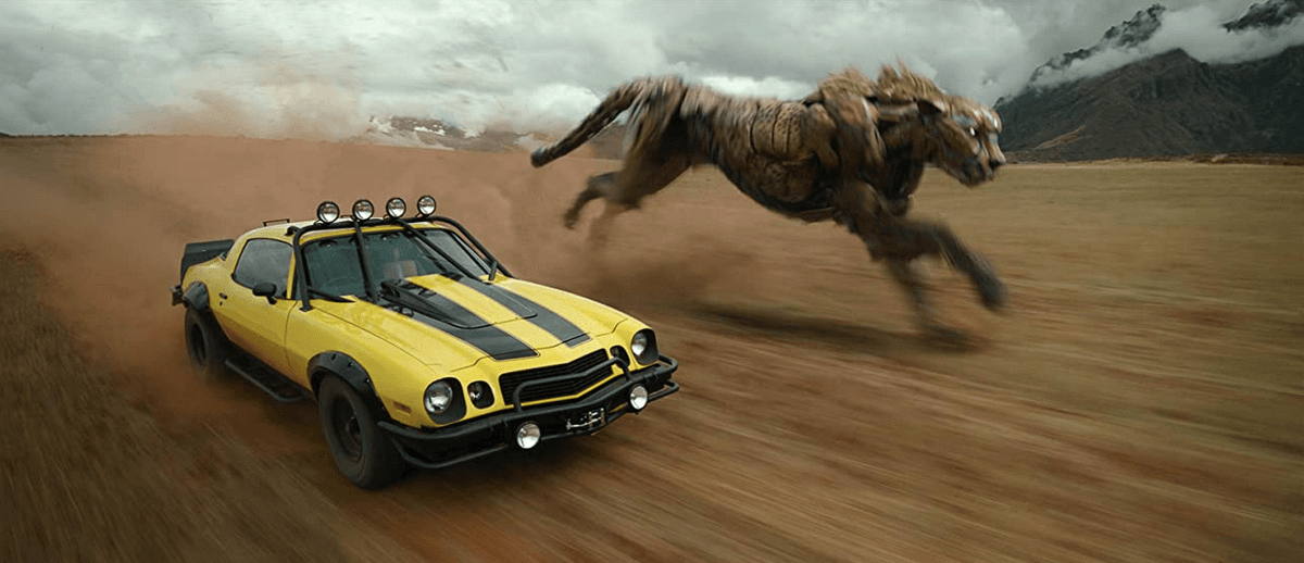 The voiceless Bumblebee in Camaro form,with Cheetor (voiced by Tongayi Chirisa), a Maximal scout who transforms into a cheetah,in “Transformers: Rise of the Beasts.” (Paramount Pictures)