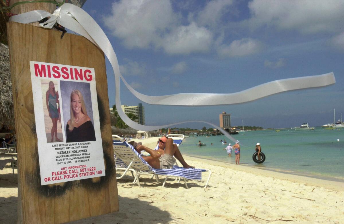 A sign of Natalee Holloway, an Alabama high school graduate who disappeared while on a graduation trip to Aruba, is seen on Palm Beach, in front of her hotel in Aruba on June 10, 2005. (Leslie Mazoch/AP Photo)