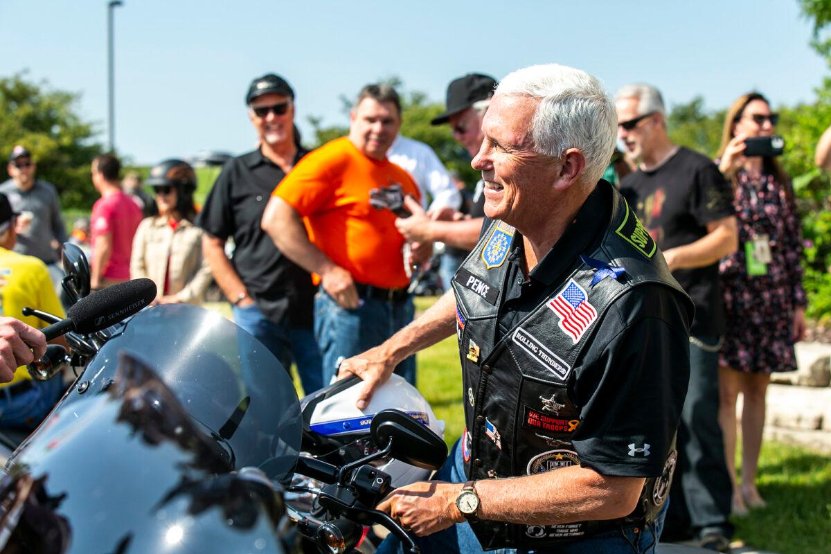 Former Vice President Mike Pence climbs onto his motorcycle during the “Roast and Ride” event in Des Moines, Iowa, on June 3, 2023. (Joseph Cress/Iowa City Press-Citizen via AP)