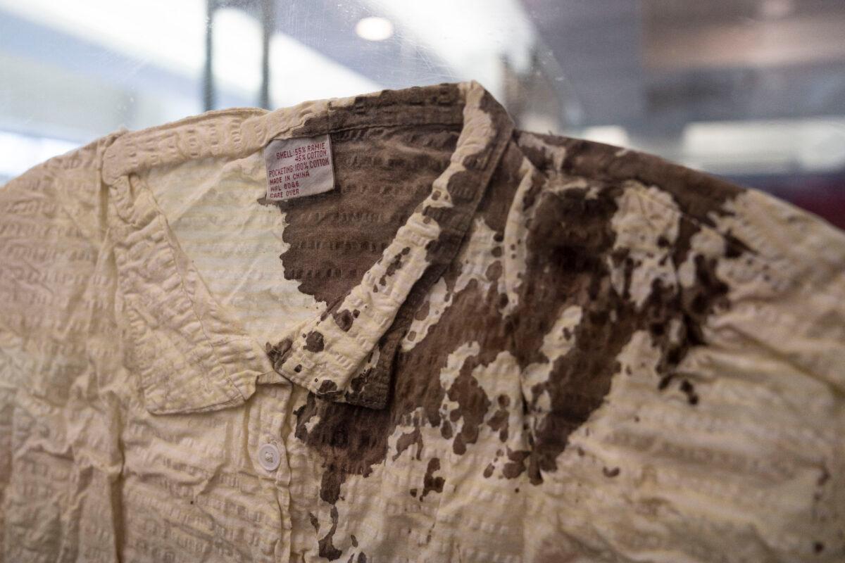A blood-soaked shirt worn by Jiang Lin, a reporter for People's Liberation Army Daily who got hit by police officers on the night of June 3, 1989, is on display at the June 4 Memorial Exhibit in New York on June 4, 2023. (Chung I Ho/The Epoch Times)