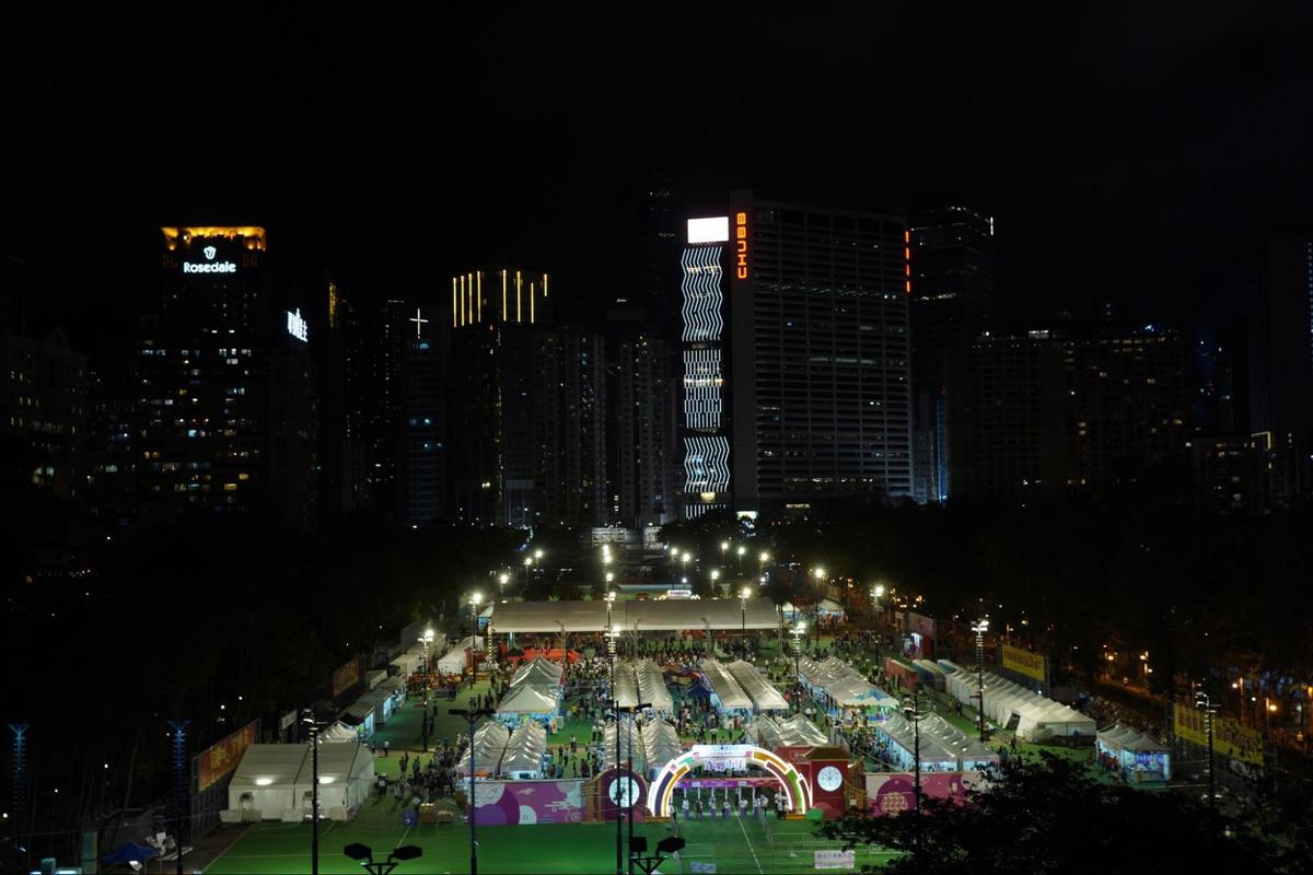 Victoria Park in Hong Kong, which used to be the place for the annual June 4 candlelight vigil, has been rented to pro-government organizations for a flea market event. Tapes had encircled unoccupied areas. June 4, 2023. (Benson Lau/The Epoch Times)
