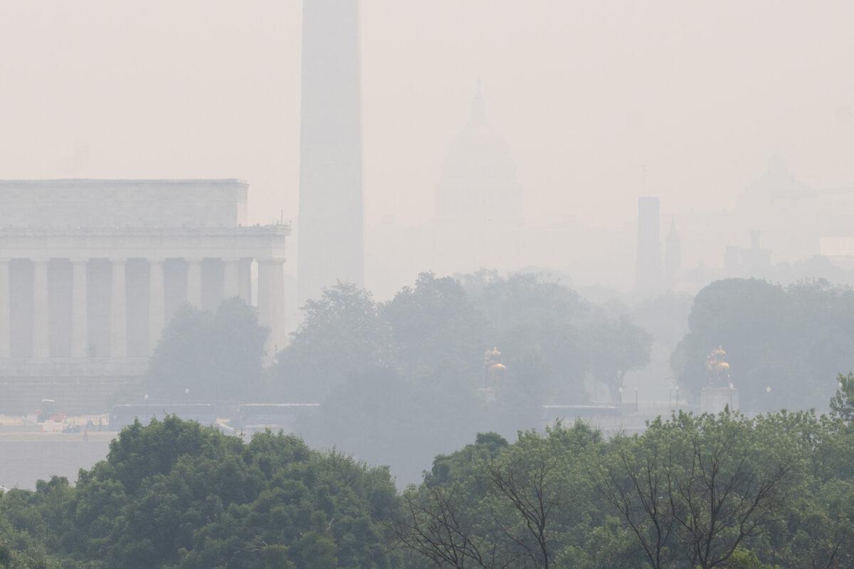 A haze lingers over the Lincoln Memorial and Washington Monument on the National Mall in Washington because of smoke from wildfires in Canada on June 7, 2023. (Saul Loeb/AFP via Getty Images)