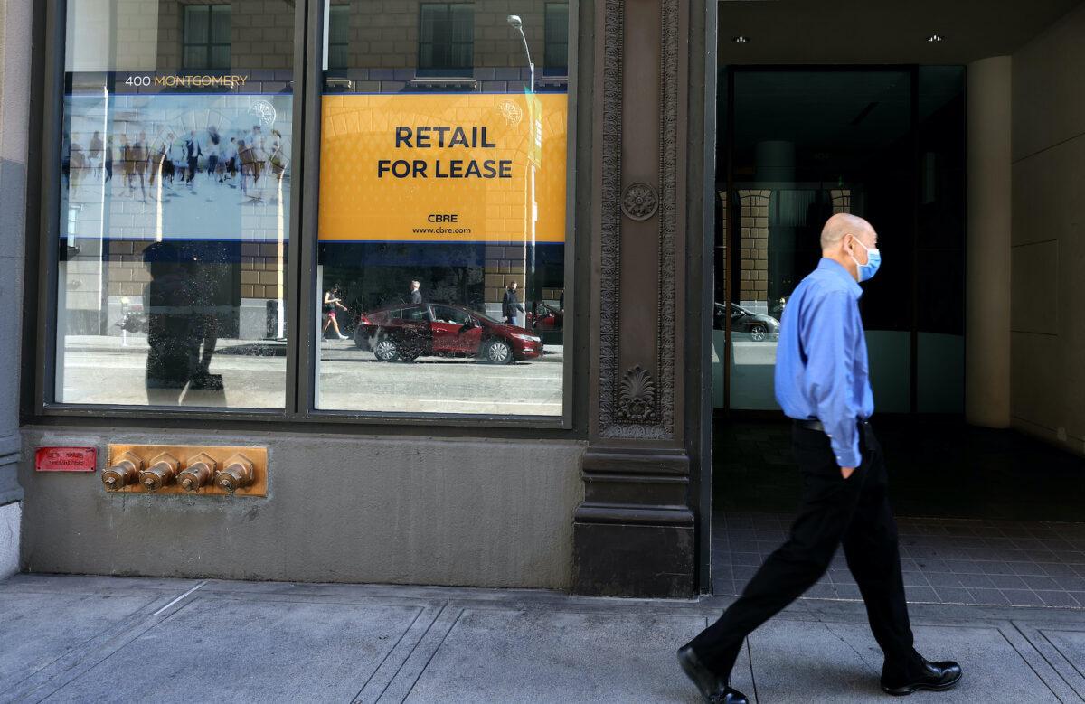 A pedestrian walks by a commercial property for lease in San Francisco on Oct. 27, 2022. (Justin Sullivan/Getty Images)