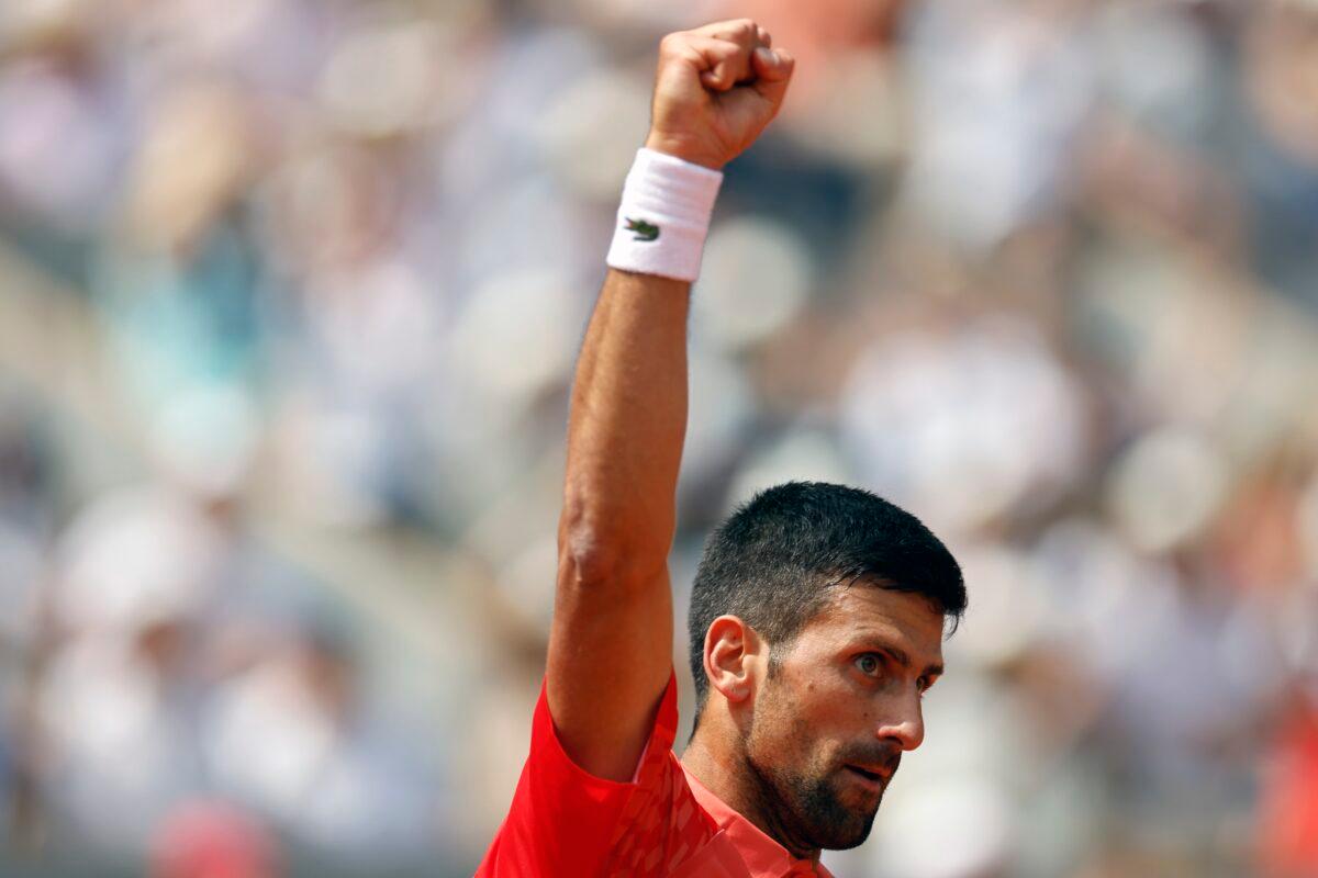 Serbia's Novak Djokovic reacts after winning the fourth game of the first set against Spain's Carlos Alcaraz during their semifinal match of the French Open tennis tournament at the Roland Garros stadium in Paris on June 9, 2023. (Jean-Francois Badias/AP Photo)