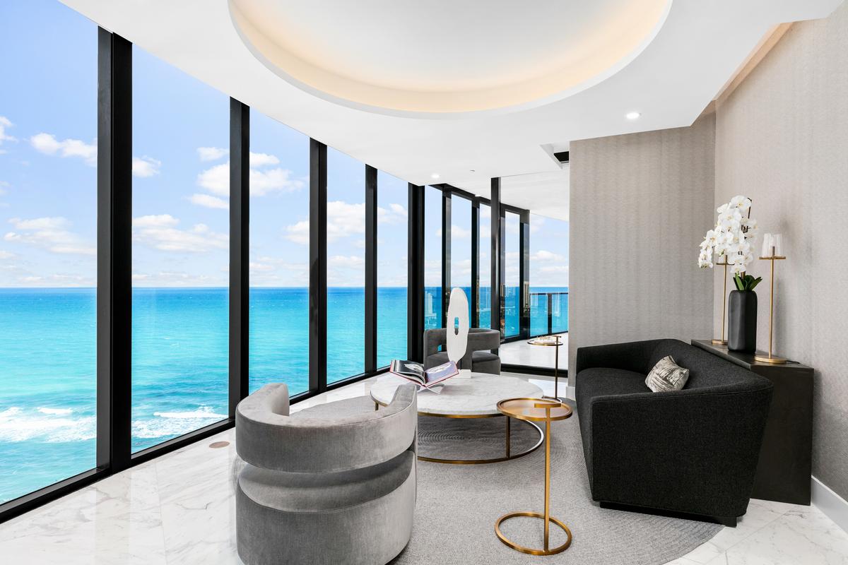Floor-to-ceiling glass walls throughout the unit ensure an unobstructed, mesmerizing view of the Atlantic Ocean. (Courtesy of The Carroll Group)