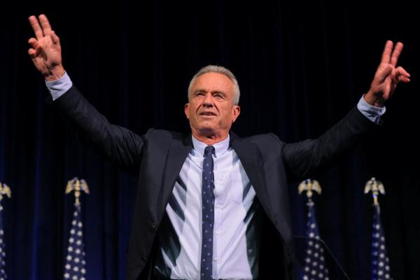 Democratic presidential candidate Robert F. Kennedy Jr. waves to the audience after delivering a foreign policy speech at St. Anselm College in Manchester, N.H., on June 20, 2023. (Brian Snyder/Reuters)