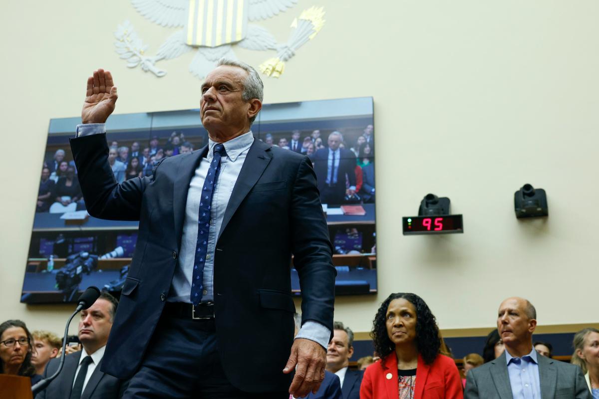Democrat presidential candidate Robert F. Kennedy Jr. holds his right hand up as he is sworn in for a hearing with the House Judiciary Subcommittee on the Weaponization of the Federal Government on Capitol Hill in Washington on July 20, 2023. (Anna Moneymaker/Getty Images)