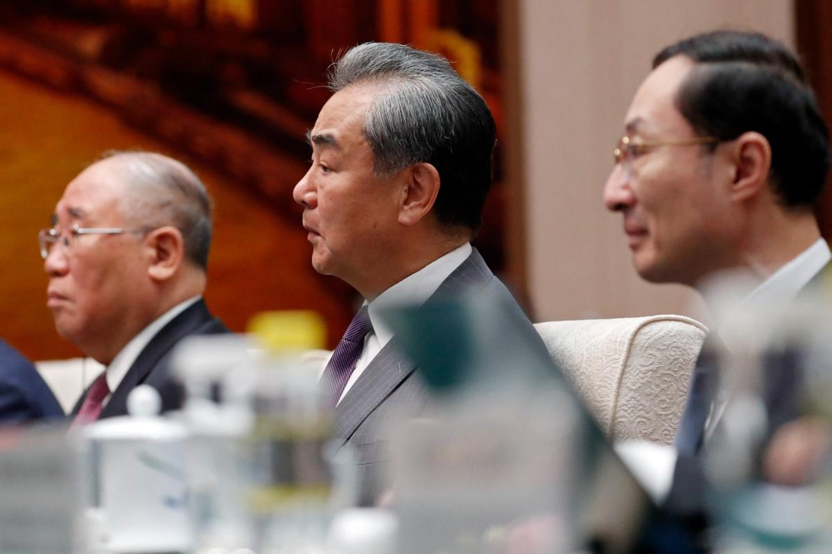 Director of the Office of the Foreign Affairs Commission of the Communist Party of China's Central Committee Wang Yi (C) attends a meeting with U.S. climate envoy John Kerry at the Great Hall of the People in Beijing on July 18, 2023. (Florence Lo/POOL/AFP via Getty Images)