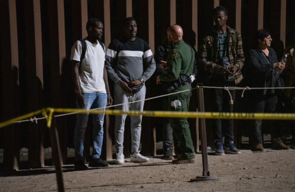 Robert F. Kennedy Jr. Makes Case for Finishing Border Wall | USNN World News Men from Ghana talk with a U.S. Border Patrol agent in Yuma, Ariz., on May 18, 2023. (John Fredricks/The Epoch times)