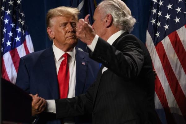 Former President Donald Trump shakes hands with South Carolina Gov. Henry McMaster (R) before speaking as the keynote speaker at the 56th Annual Silver Elephant Dinner hosted by the South Carolina Republican Party in Columbia, S.C., on Aug. 5, 2023. (Melissa Sue Gerrits/Getty Images)