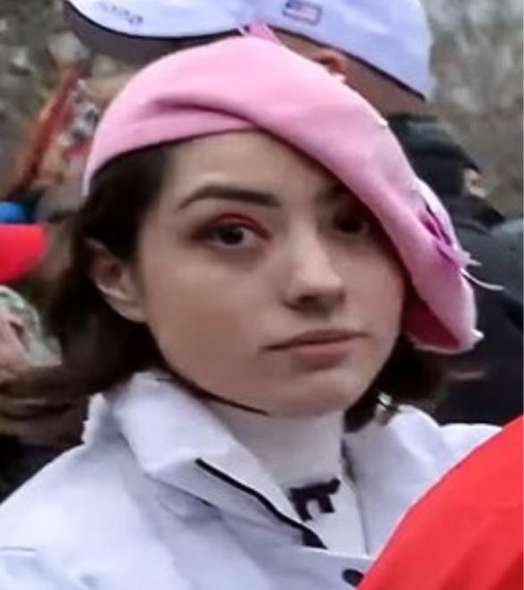 A woman at the time known only as "Pink Beret" directed and lured people into the U.S. Capitol on Jan. 6, 2021, a defense attorney contends. (U.S. District Court-Open Source Video/Screenshots via The Epoch Times)