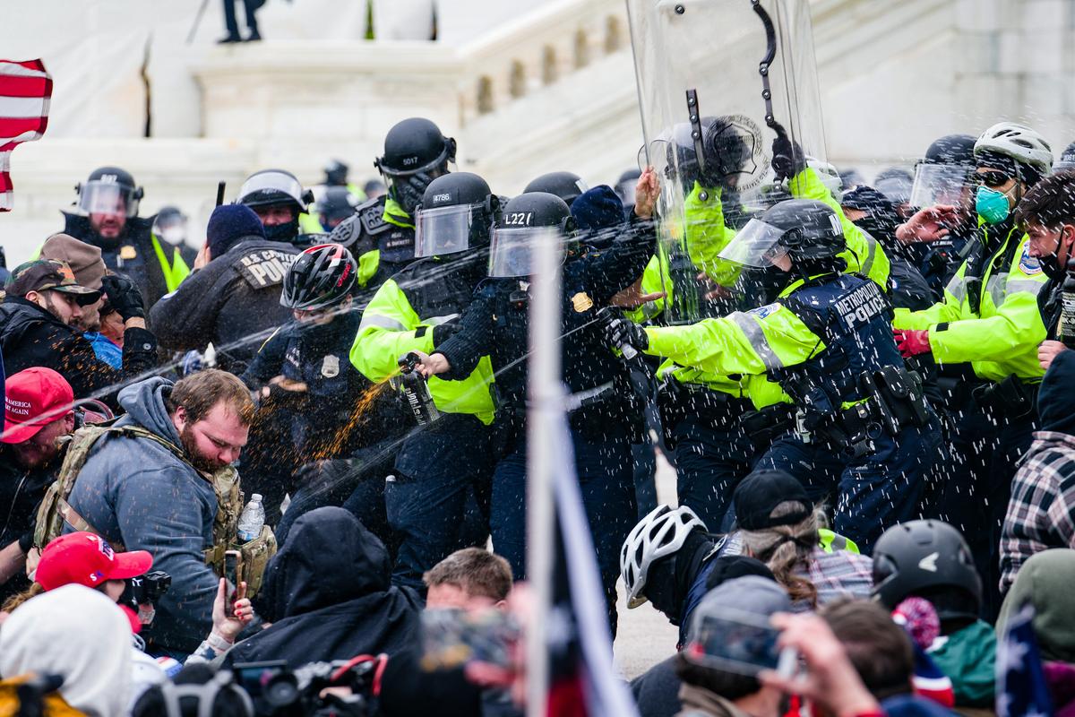 Pepper spray is used during a clash between protesters and police officers at the U.S. Capitol in Washington on Jan. 6, 2021. (Leo Shi/The Epoch Times)