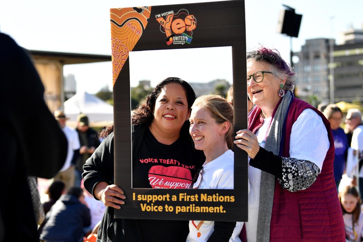 Supporters hold placards during a Yes 23 community event in support of an Indigenous Voice to Parliament, in Sydney, Australia, on July 2, 2023. (AAP Image/Bianca De Marchi)