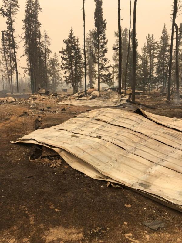 Metal roofing from part of Tammy Neal's home lies on the ground after a wildfire tore through Enterprise, Northwest Territories, on Aug. 13, 2023. (Courtesy of Tammy Neal)