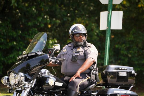 Sheriff Patrick Labat, on a motorcycle, patrols an entrance of the Fulton County Jail in Atlanta, Ga., on Aug. 23, 2023. (Madalina Vasiliu/The Epoch Times)