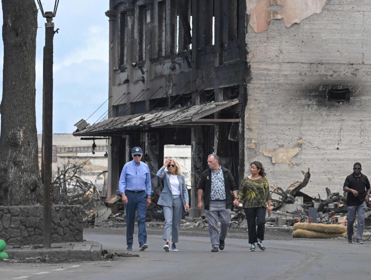 (L-R) President Joe Biden, First Lady Jill Biden, Hawaii Governor Josh Green, and wife Jaime Green walk along Front Street to inspect wildfire damage in Lahaina, Hawaii on August 21, 2023. (Mandel NGAN/AFP via Getty Images)